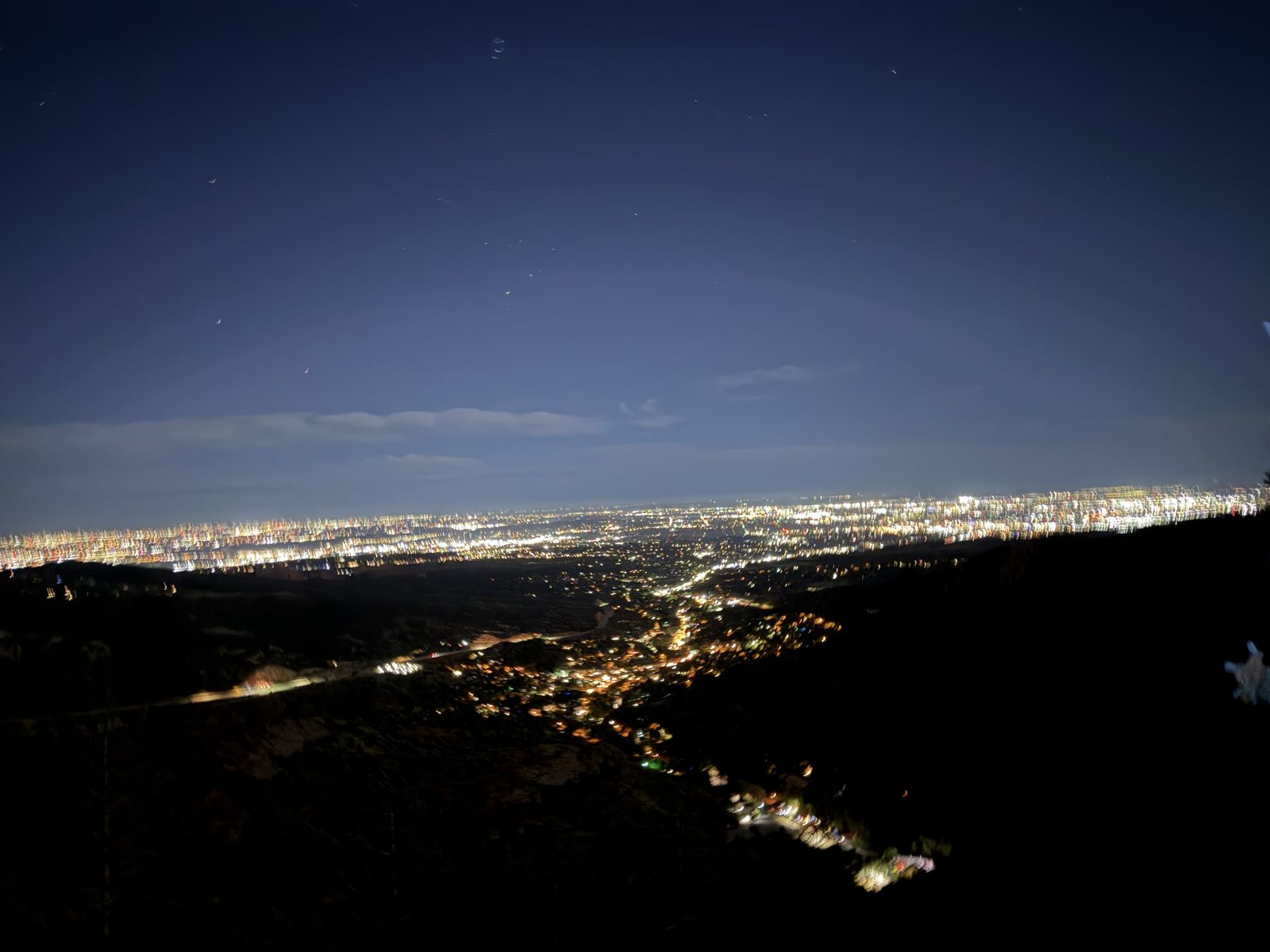 City lights below Pikes Peak at dusk